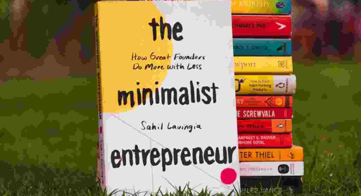 Entrepreneurship Book Surrounded by business book representing founder development.
